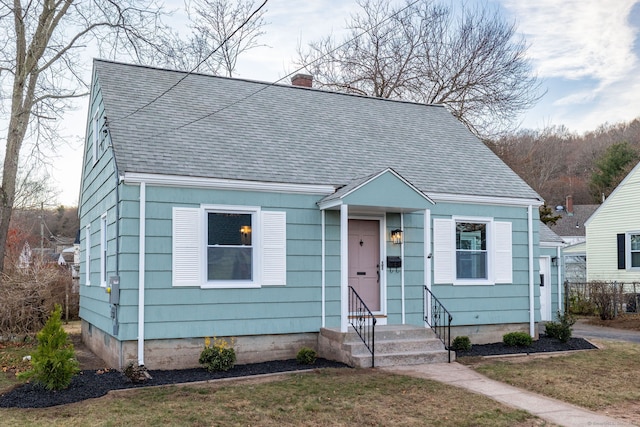 bungalow with a front yard