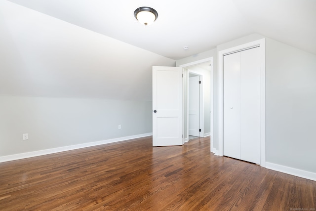 bonus room featuring dark hardwood / wood-style floors and lofted ceiling