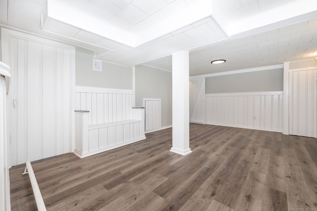 basement featuring dark hardwood / wood-style flooring