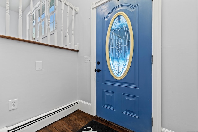 entrance foyer with baseboard heating and dark wood-type flooring