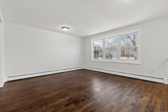 unfurnished room with a textured ceiling, dark hardwood / wood-style flooring, and a baseboard heating unit