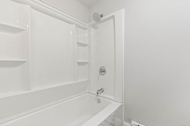 bathroom with tub / shower combination