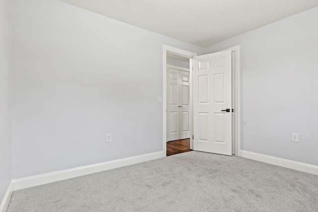 unfurnished room featuring carpet flooring