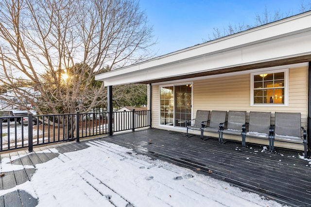 view of snow covered deck