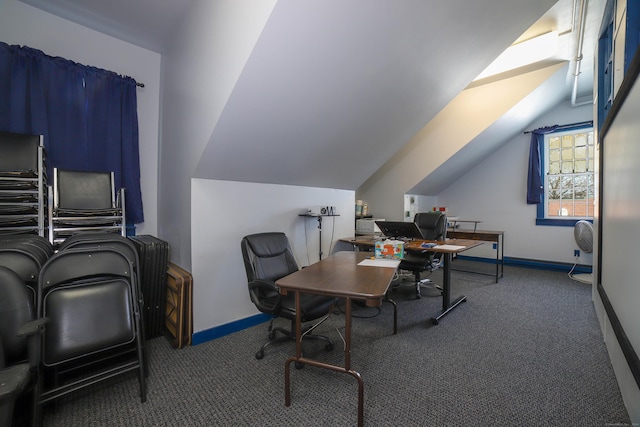 carpeted office featuring lofted ceiling