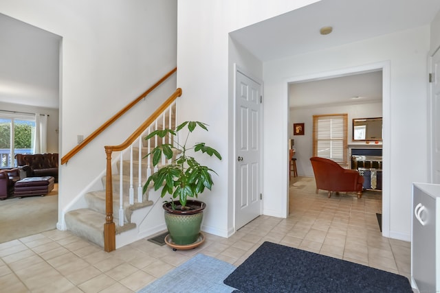 view of carpeted entrance foyer