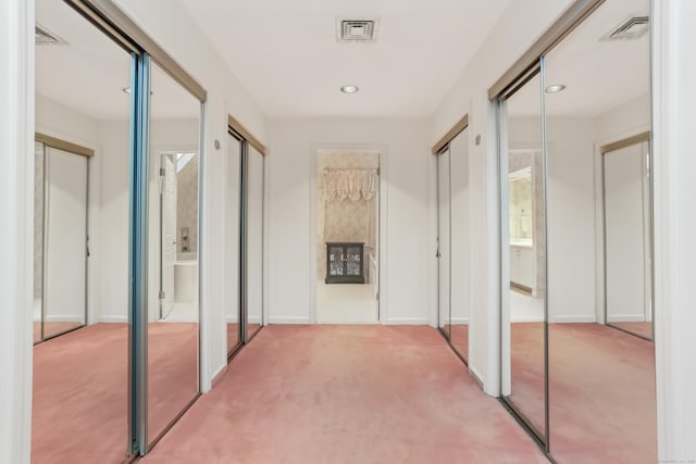 corridor with carpet flooring