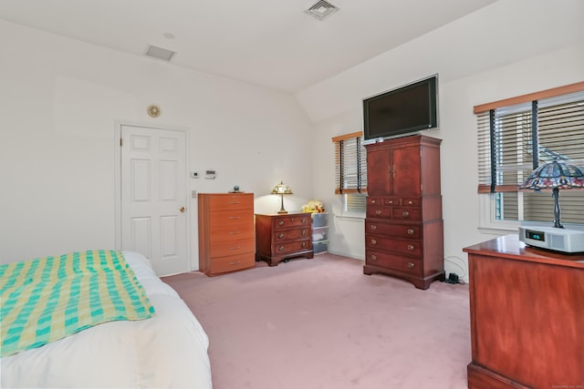 carpeted bedroom featuring vaulted ceiling