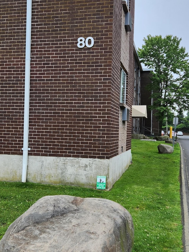 view of side of property with a yard