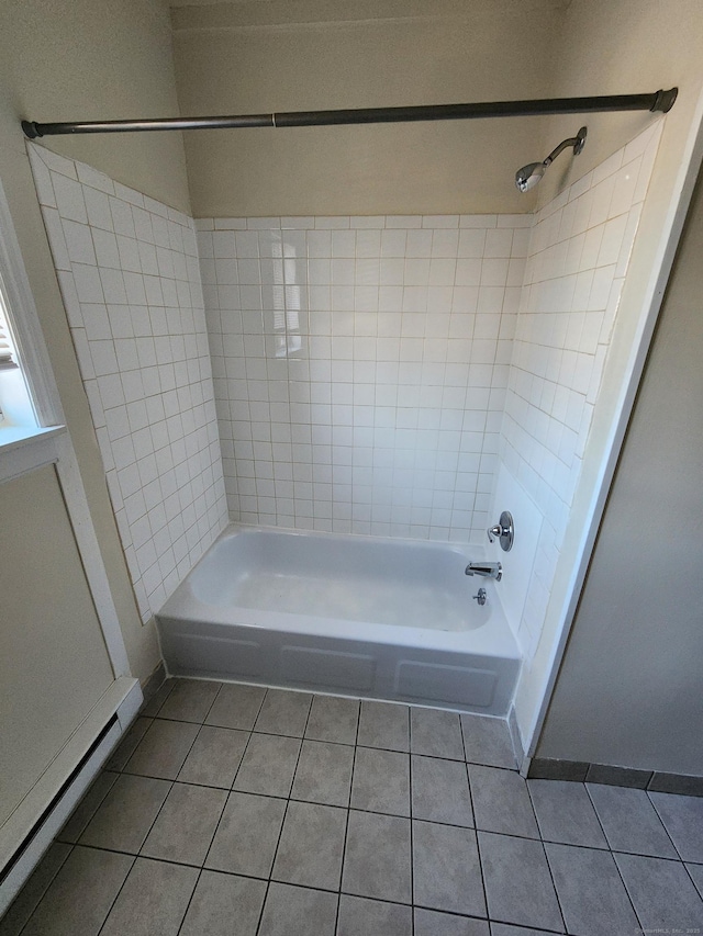 bathroom with tub / shower combination, baseboard heating, and tile patterned flooring