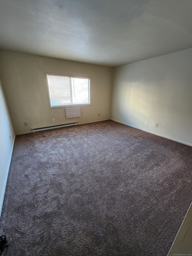 carpeted empty room with baseboard heating