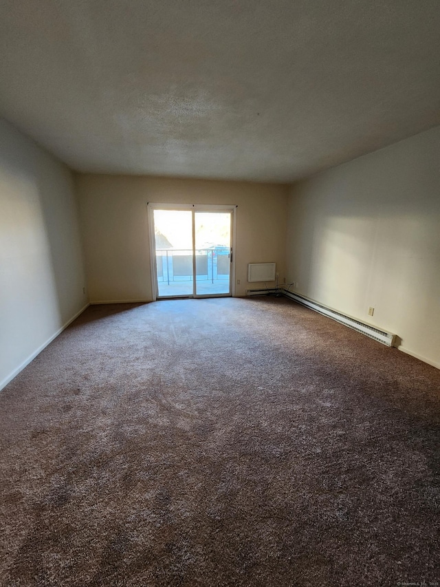 unfurnished room featuring carpet floors, a textured ceiling, and a baseboard heating unit