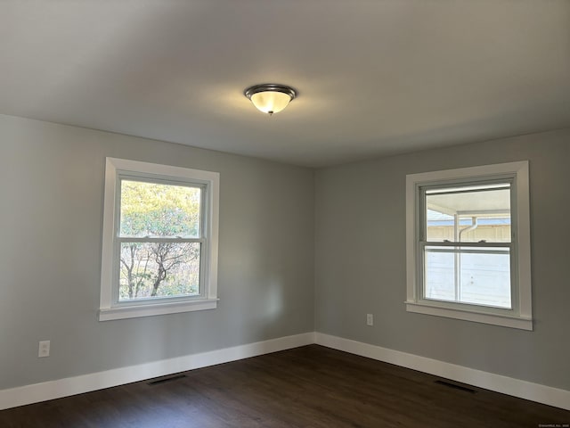 empty room featuring dark hardwood / wood-style floors