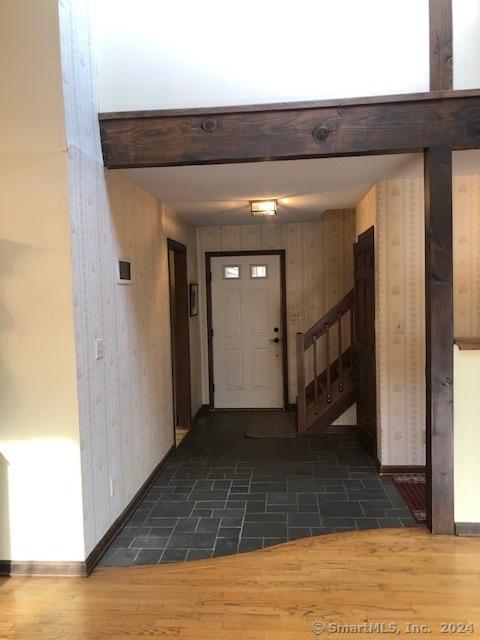 entryway with dark wood-type flooring