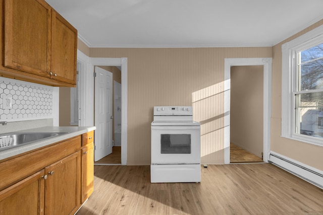 kitchen featuring white range with electric cooktop, crown molding, baseboard heating, tasteful backsplash, and light hardwood / wood-style floors