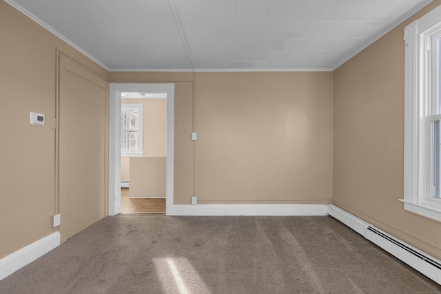 spare room featuring carpet, a baseboard radiator, and ornamental molding