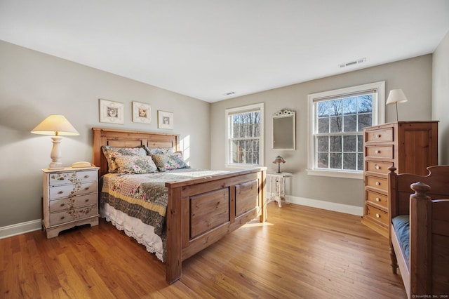 bedroom with light hardwood / wood-style flooring