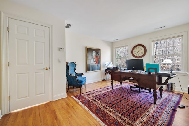 office area with wood-type flooring