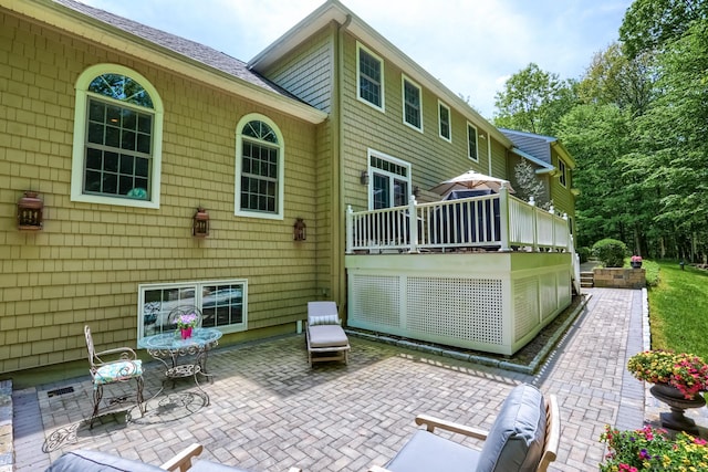 back of house with a patio