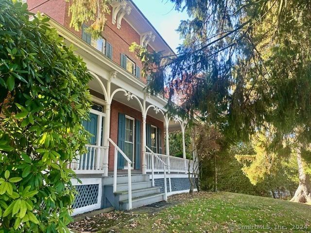 exterior space with a yard and covered porch