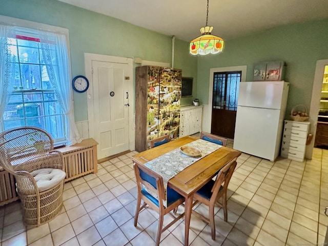 kitchen with white refrigerator and light tile patterned floors