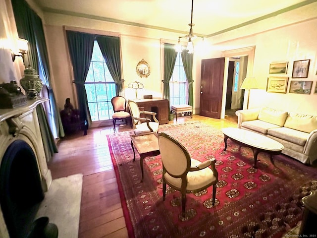 living room featuring hardwood / wood-style floors and an inviting chandelier