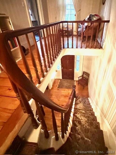 stairway featuring hardwood / wood-style flooring