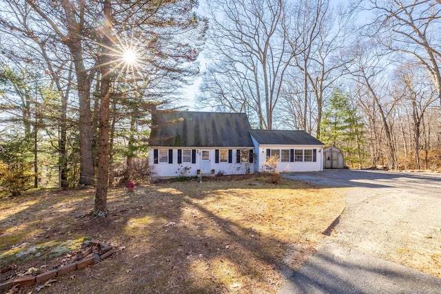 view of front of house featuring a garage and an outdoor structure