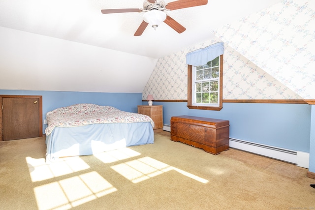 carpeted bedroom featuring ceiling fan, lofted ceiling, and a baseboard radiator