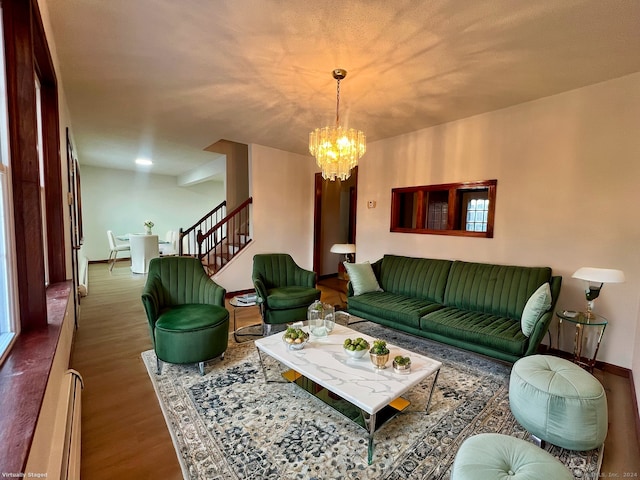 living room with dark hardwood / wood-style flooring and a chandelier