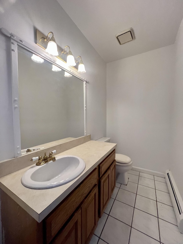 bathroom with tile patterned flooring, vanity, a baseboard radiator, and toilet