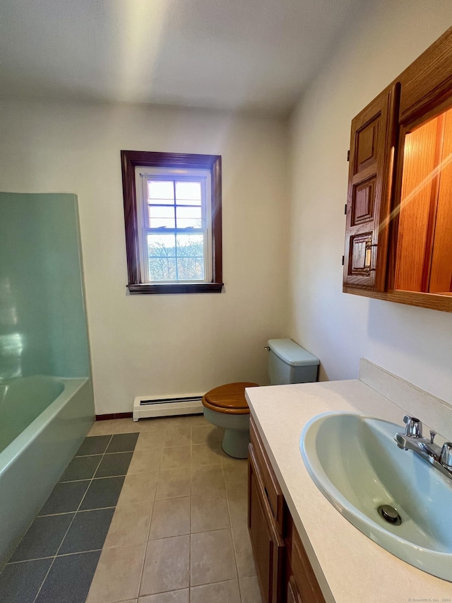 bathroom featuring a bathing tub, tile patterned flooring, a baseboard heating unit, toilet, and vanity