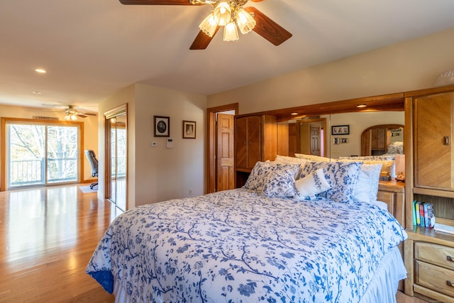 bedroom with ceiling fan and light hardwood / wood-style floors