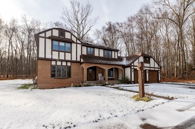 tudor house featuring a porch