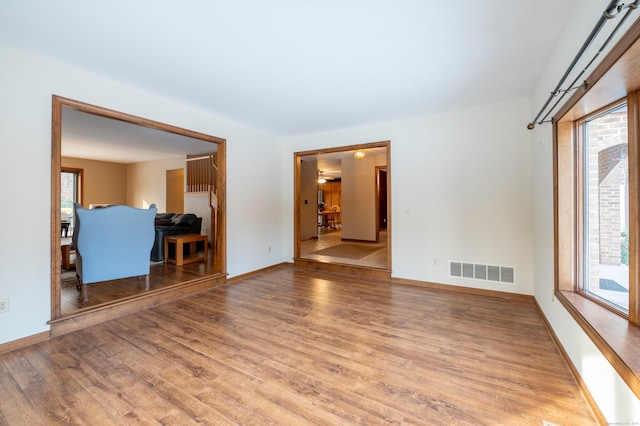 empty room featuring hardwood / wood-style flooring