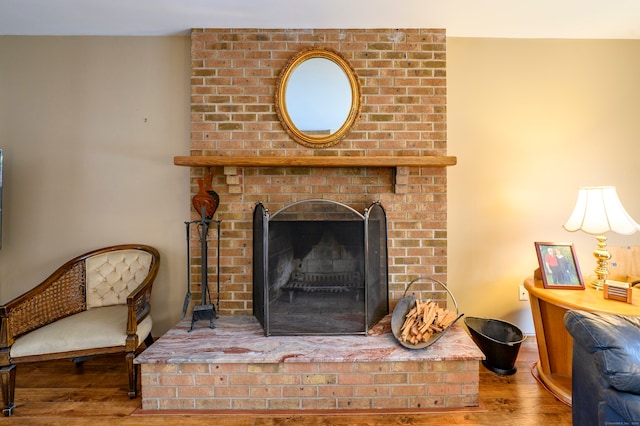 room details with hardwood / wood-style flooring and a brick fireplace