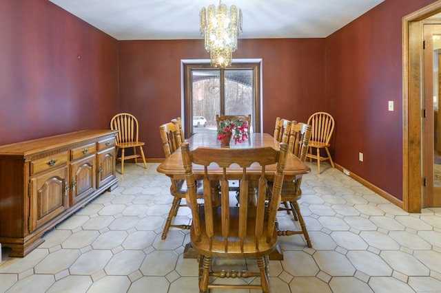 dining space featuring a notable chandelier