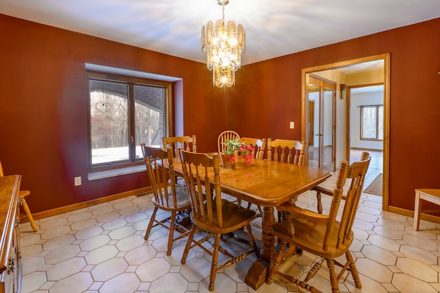 dining area with a wealth of natural light and an inviting chandelier