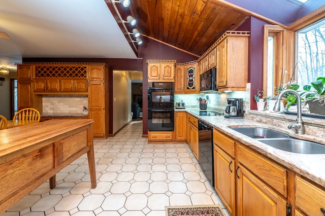 kitchen with tasteful backsplash, sink, black appliances, and lofted ceiling