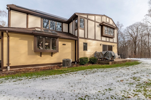 snow covered house with cooling unit