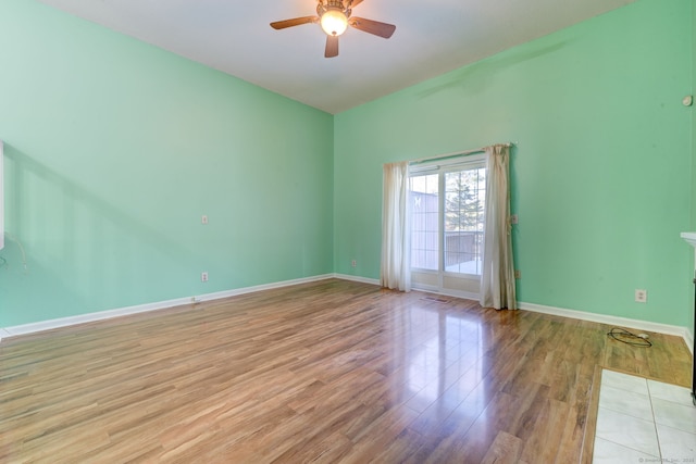 unfurnished room with ceiling fan and light hardwood / wood-style floors