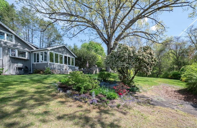 view of yard with a sunroom