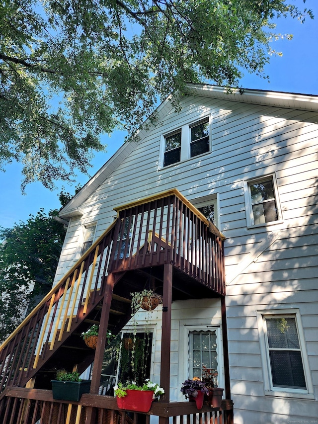 back of property featuring a deck