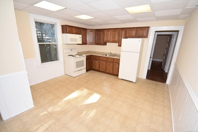 kitchen featuring sink and white appliances