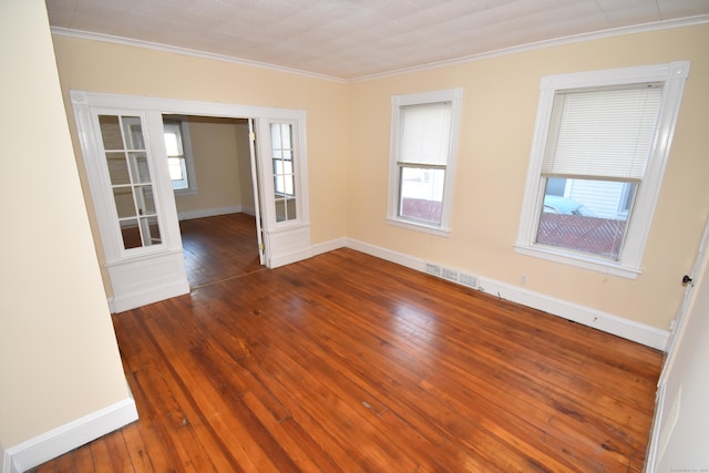 spare room with dark hardwood / wood-style floors and ornamental molding