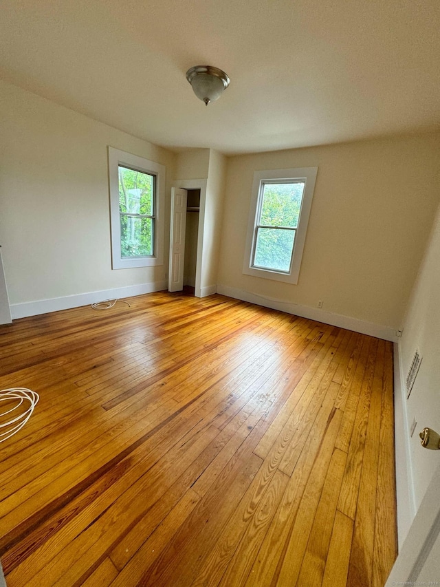 spare room with light wood-type flooring