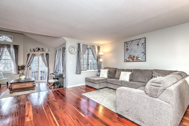 living room featuring hardwood / wood-style floors and a textured ceiling