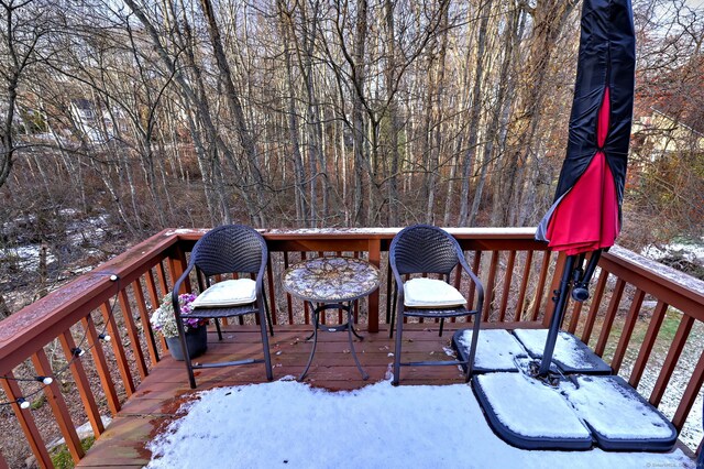 view of snow covered deck