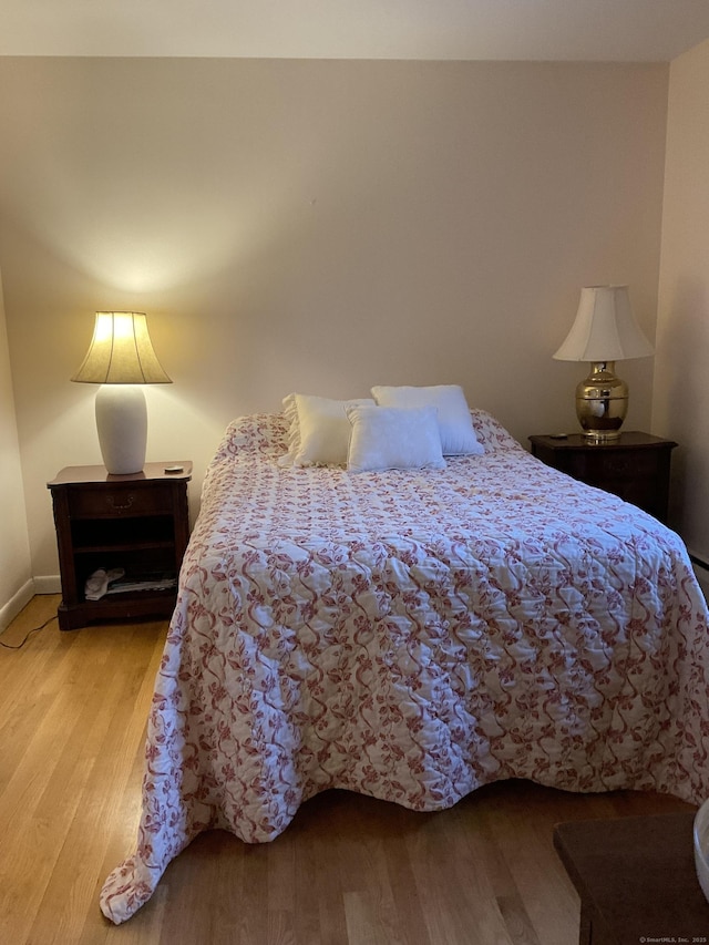 bedroom with light hardwood / wood-style flooring