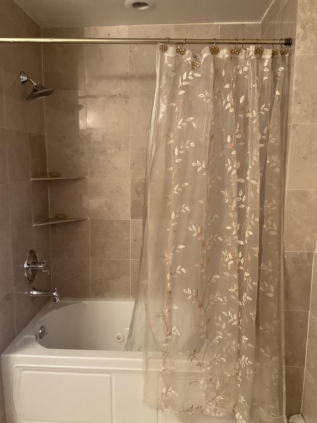 bathroom with shower / bath combo